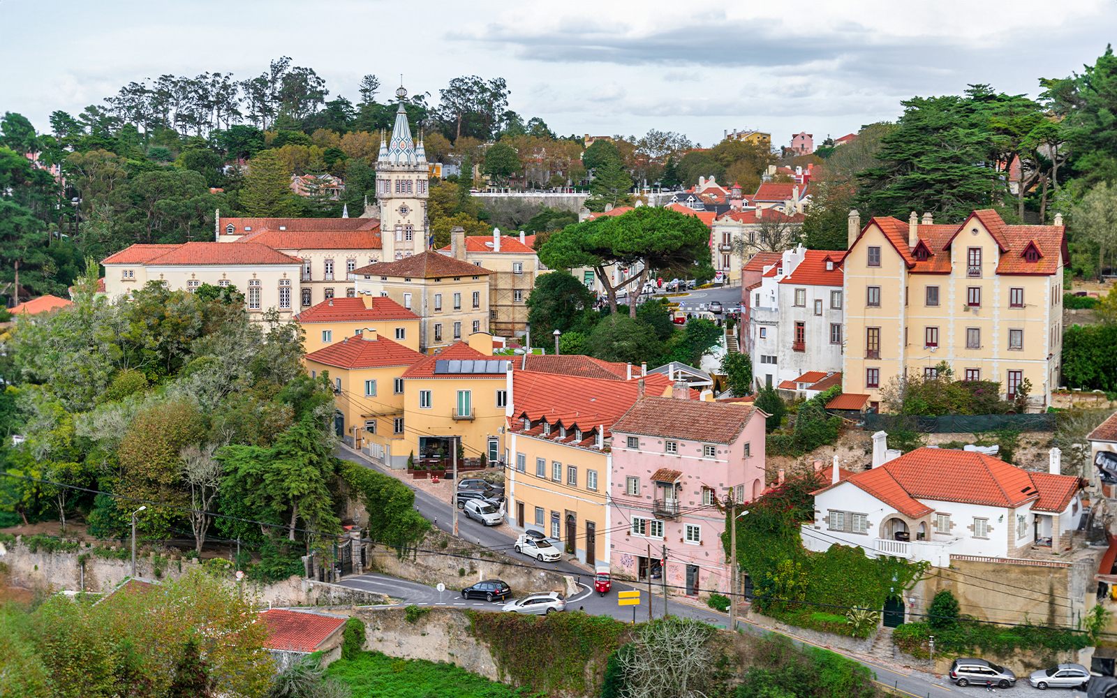 Sintra village view with colorful buildings and lush greenery, near Pena Palace, Portugal.