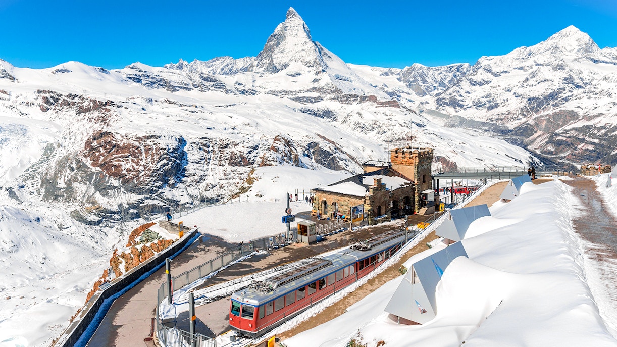Gornergrat train at Gornergrat Railway Station with Matterhorn in the Swiss Alps.