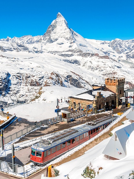 Gornergrat train at Gornergrat Railway Station with Matterhorn in the Swiss Alps.
