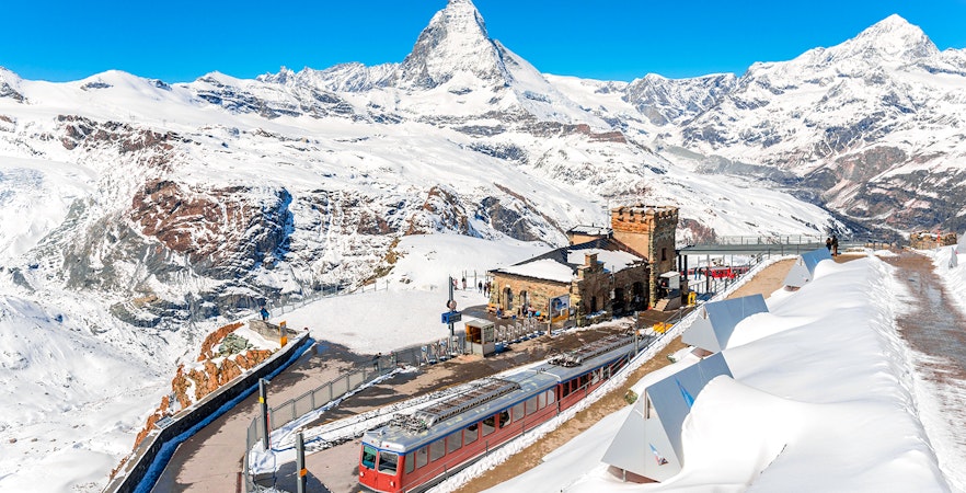 Gornergrat train at Gornergrat Railway Station with Matterhorn in the Swiss Alps.