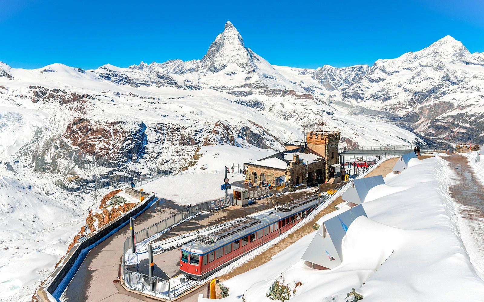 Gornergrat train at Gornergrat Railway Station with Matterhorn in the Swiss Alps.