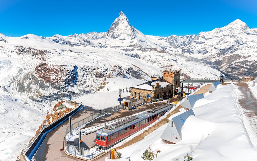 Gornergrat train at Gornergrat Railway Station with Matterhorn in the Swiss Alps.