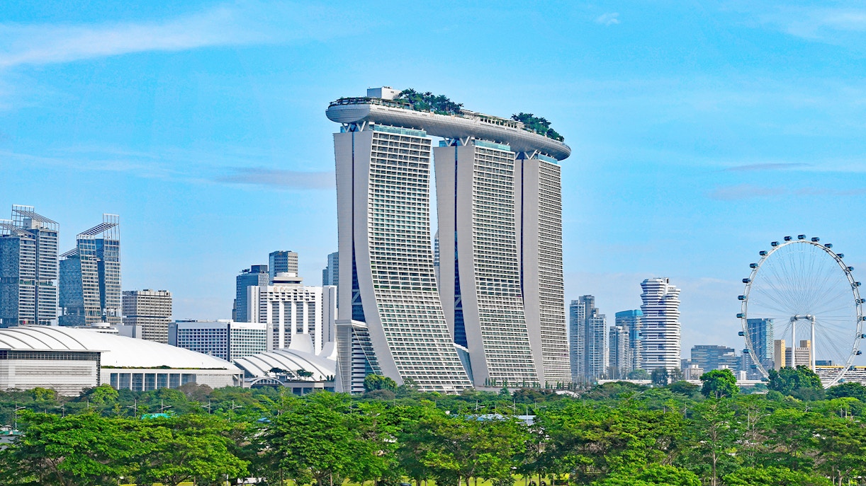 Marina Bay Sands rooftop infinity pool overlooking Singapore skyline.