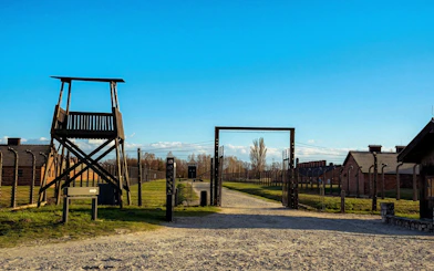 Wooden guard tower and barracks at Auschwitz II-Birkenau, part of Krakow guided tour.