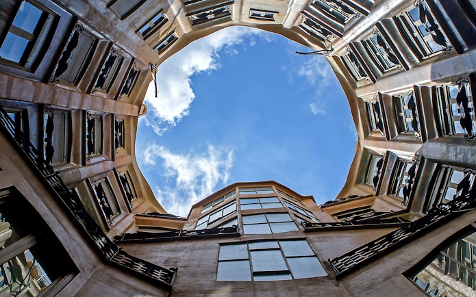 Casa Mila courtyard view with open sky in Barcelona.