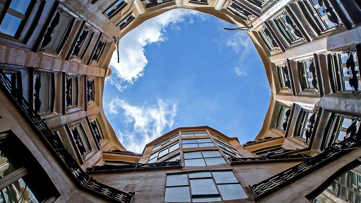 Casa Mila courtyard view with open sky in Barcelona.