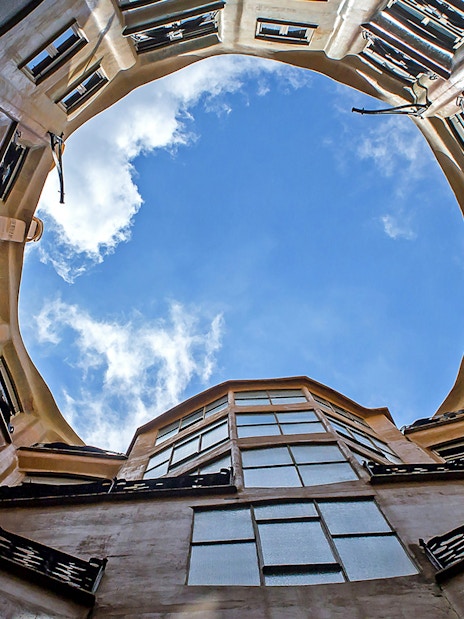 Casa Mila courtyard view with open sky in Barcelona.