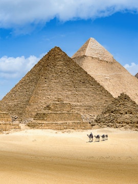Pyramids of Giza with camels in the foreground, Egypt.