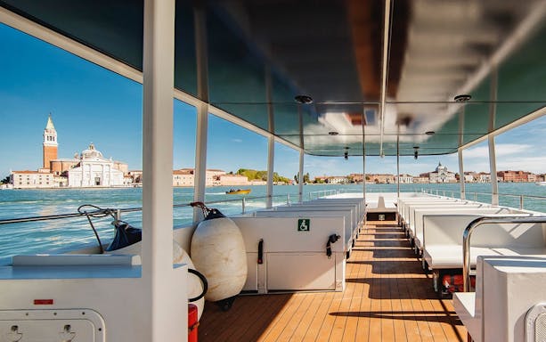 Interior of Venice Panoramic Boat Tour with view of San Giorgio Maggiore.