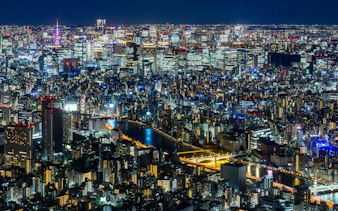 Tokyo cityscape illuminated at night from TOKYO SKYTREE Tembo Deck.