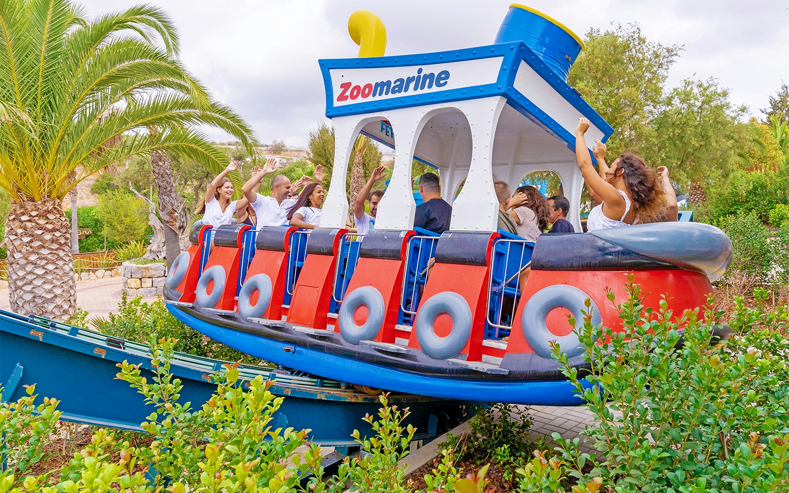 Dolphin show at Zoomarine Algarve, Portugal with trainers performing tricks.