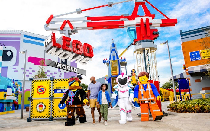 Visitors walking with LEGO characters at The LEGO Movie World, LEGOLAND® California.