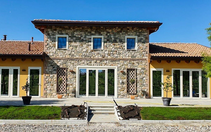 Stone building exterior at a vinegar cellar, location for guided tastings.