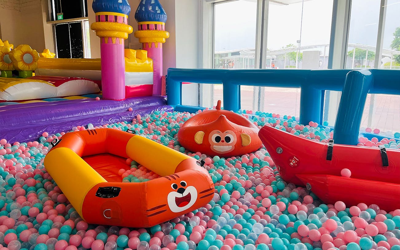 Inflatable playground with colorful ball pit at Bouncetopia by Kiztopia, VivoCity.