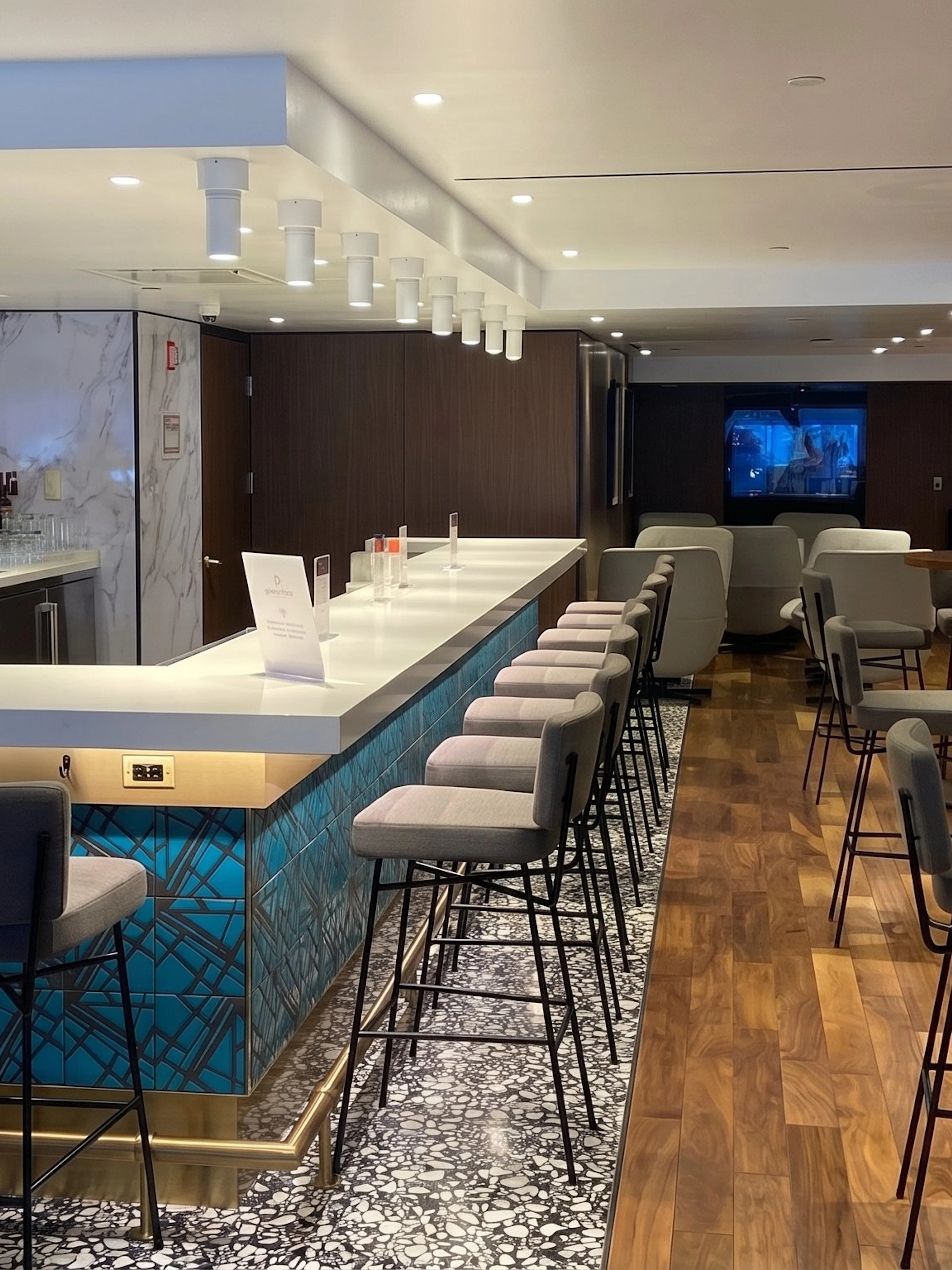 Primeclass Lounge bar area with seating at JFK International Airport, New York.