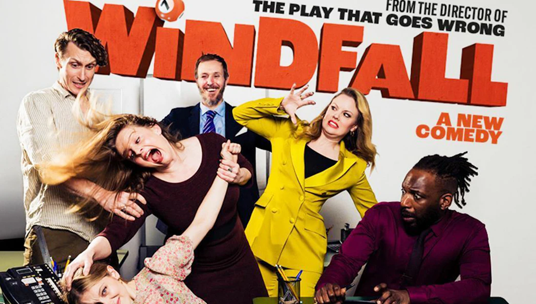 Cast of Windfall comedy play in a chaotic office scene