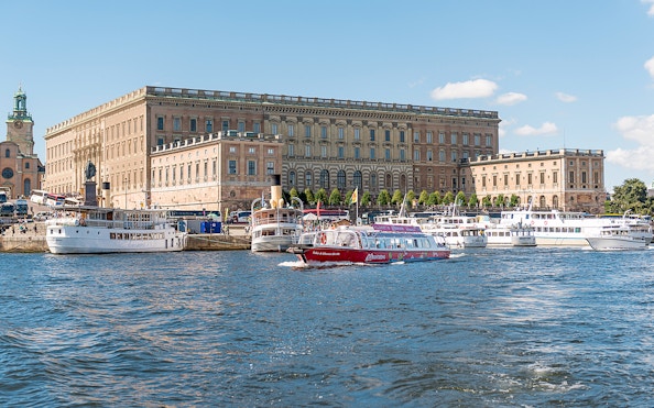 Boats on the water near the Royal Palace in Stockholm, Sweden.