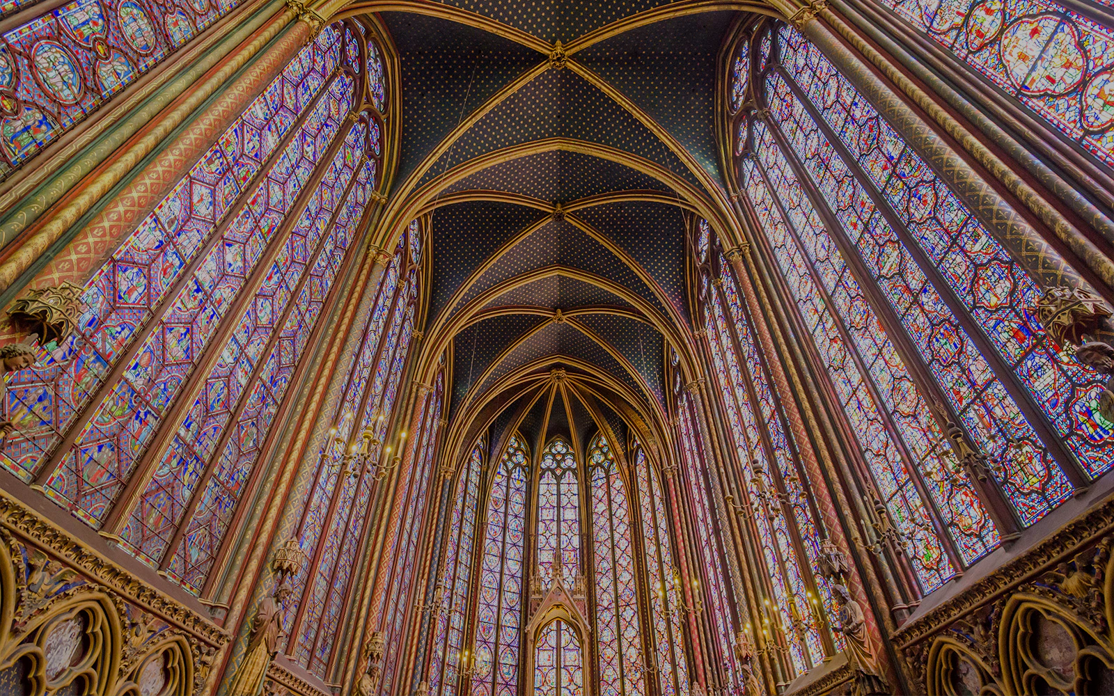 Stained glass windows and vaulted ceiling of Sainte-Chapelle, Paris.