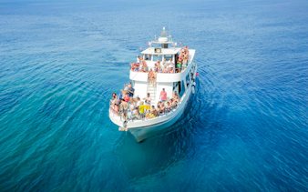 Tourists on a boat enjoying the Blue Lagoon cruise from Protaras, Cyprus.