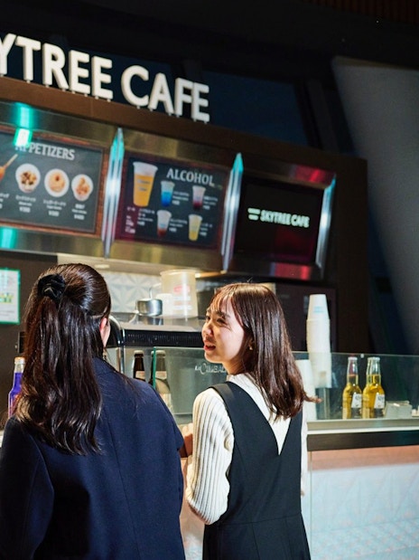 Tourists ordering drinks at Skytree Cafe Tembo deck.