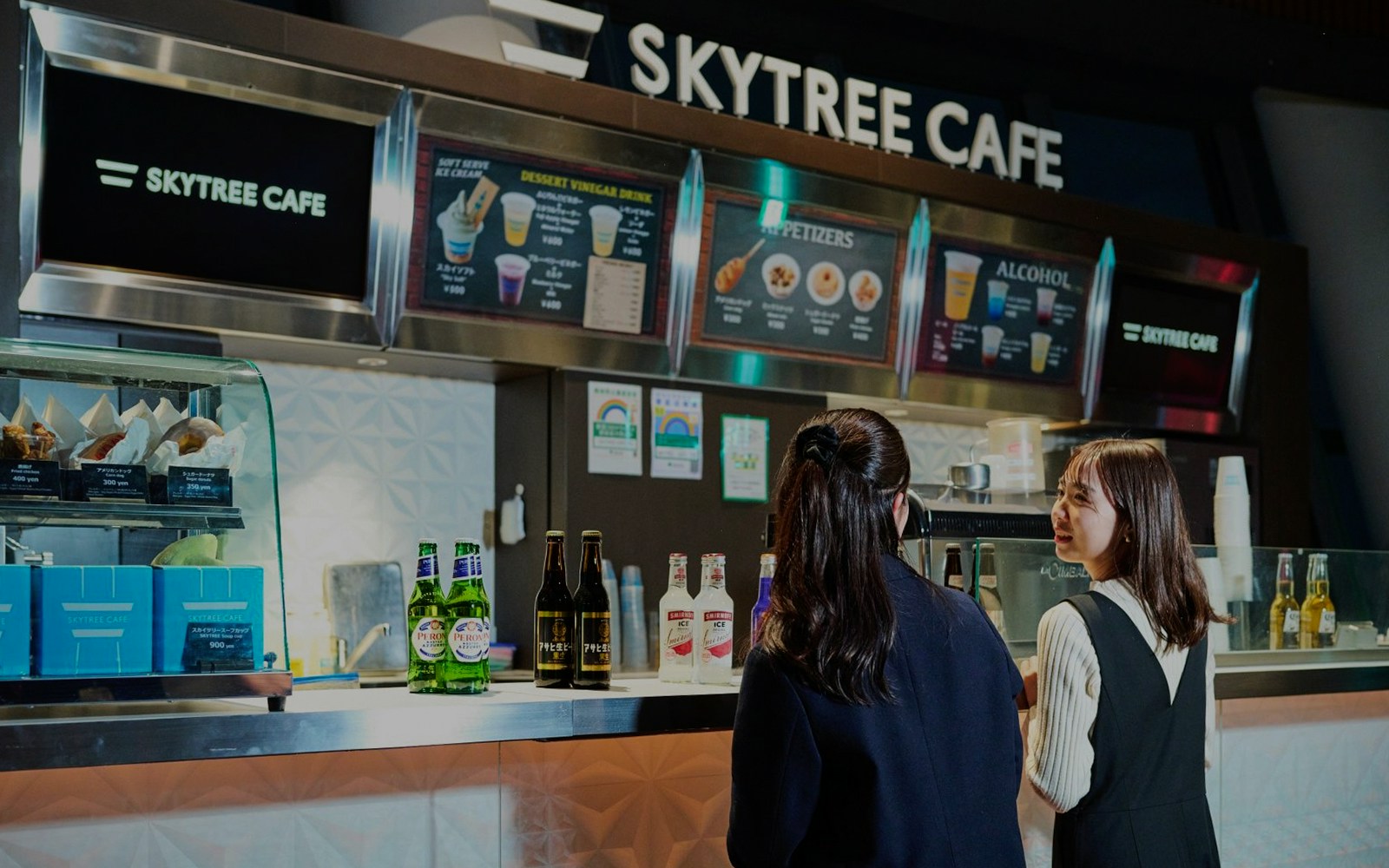 Tourists ordering drinks at Skytree Cafe Tembo deck.