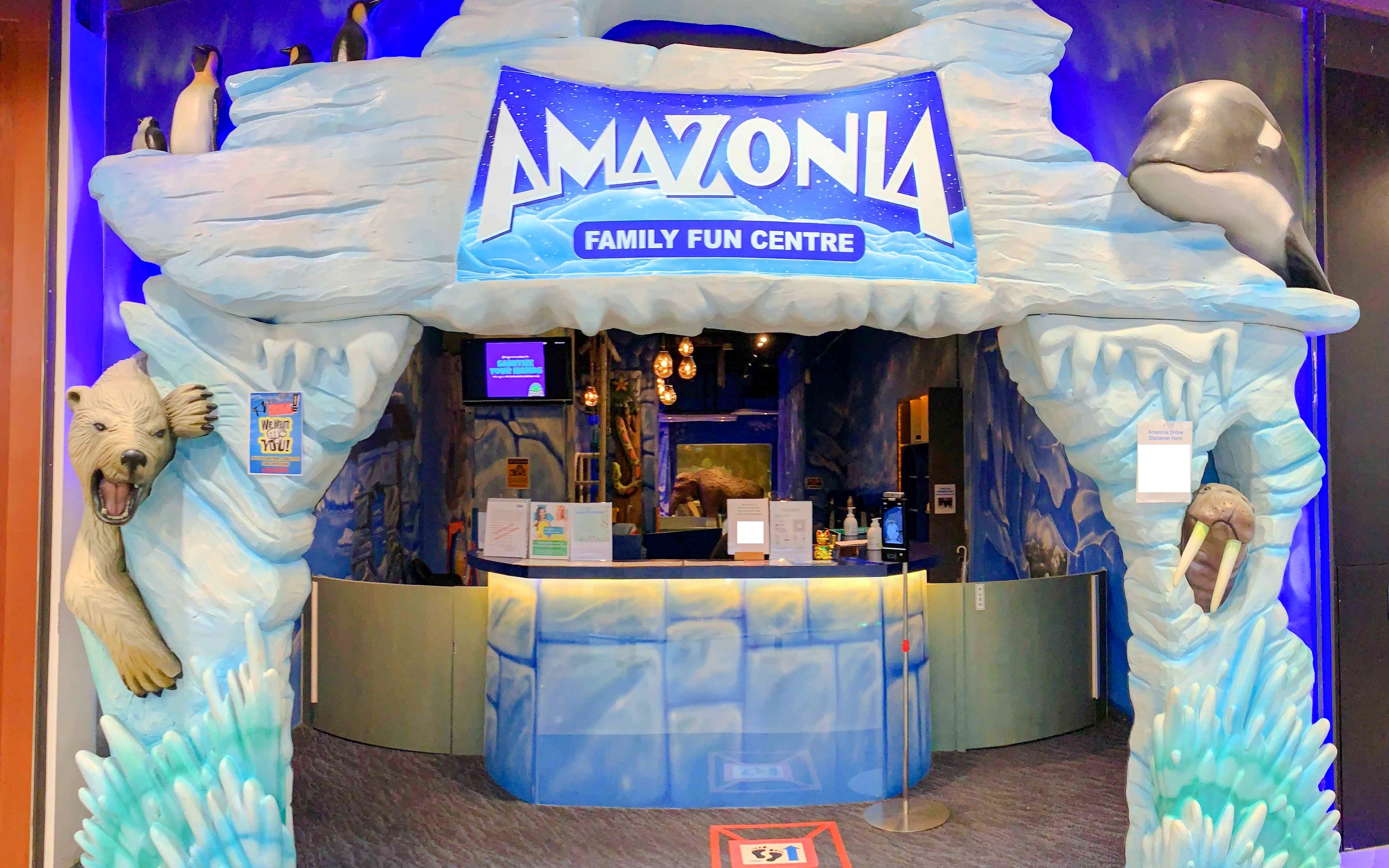 Entrance to Amazonia Family Fun Centre in Singapore with polar bear and penguin sculptures.