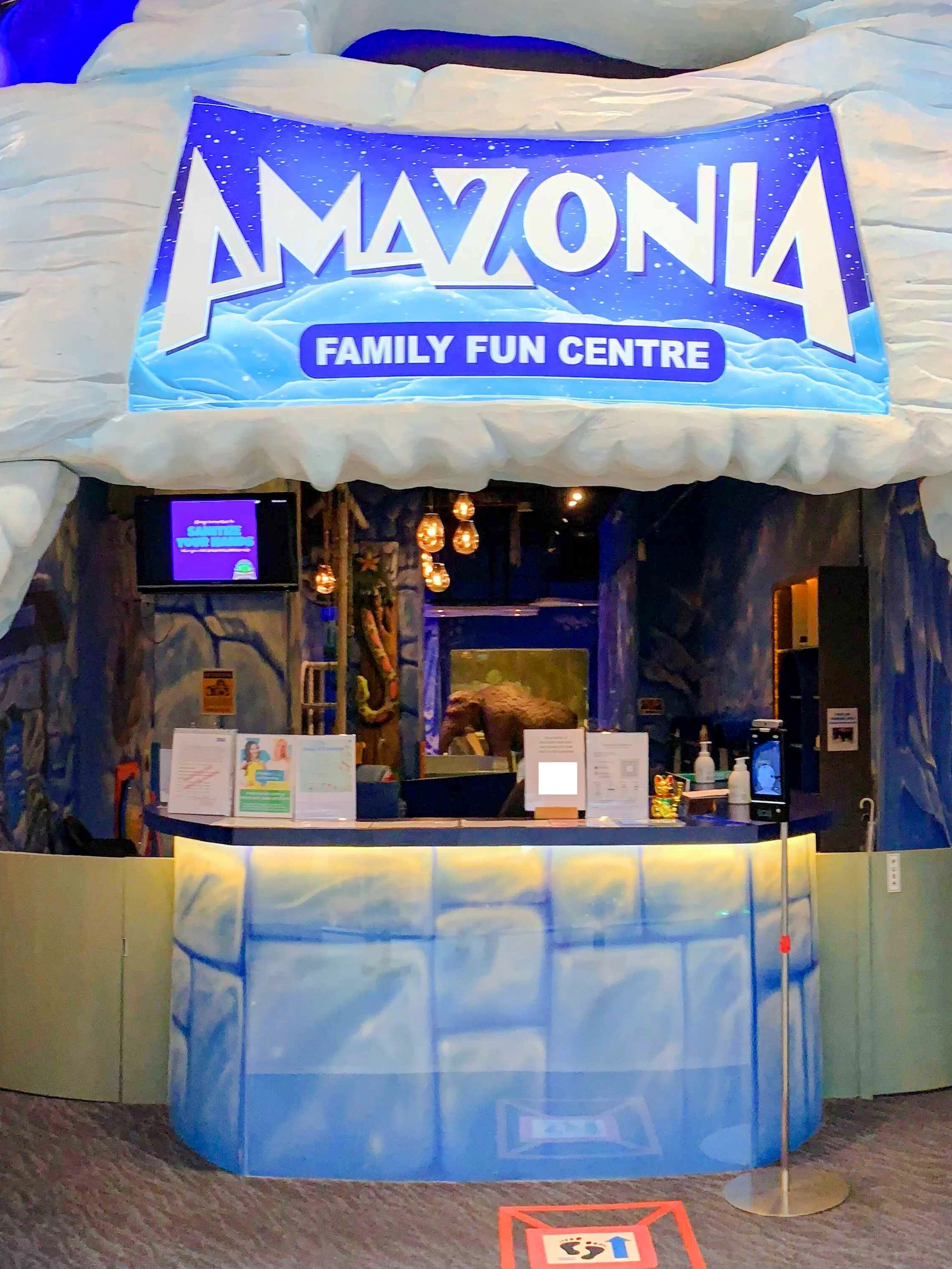 Entrance to Amazonia Family Fun Centre in Singapore with polar bear and penguin sculptures.