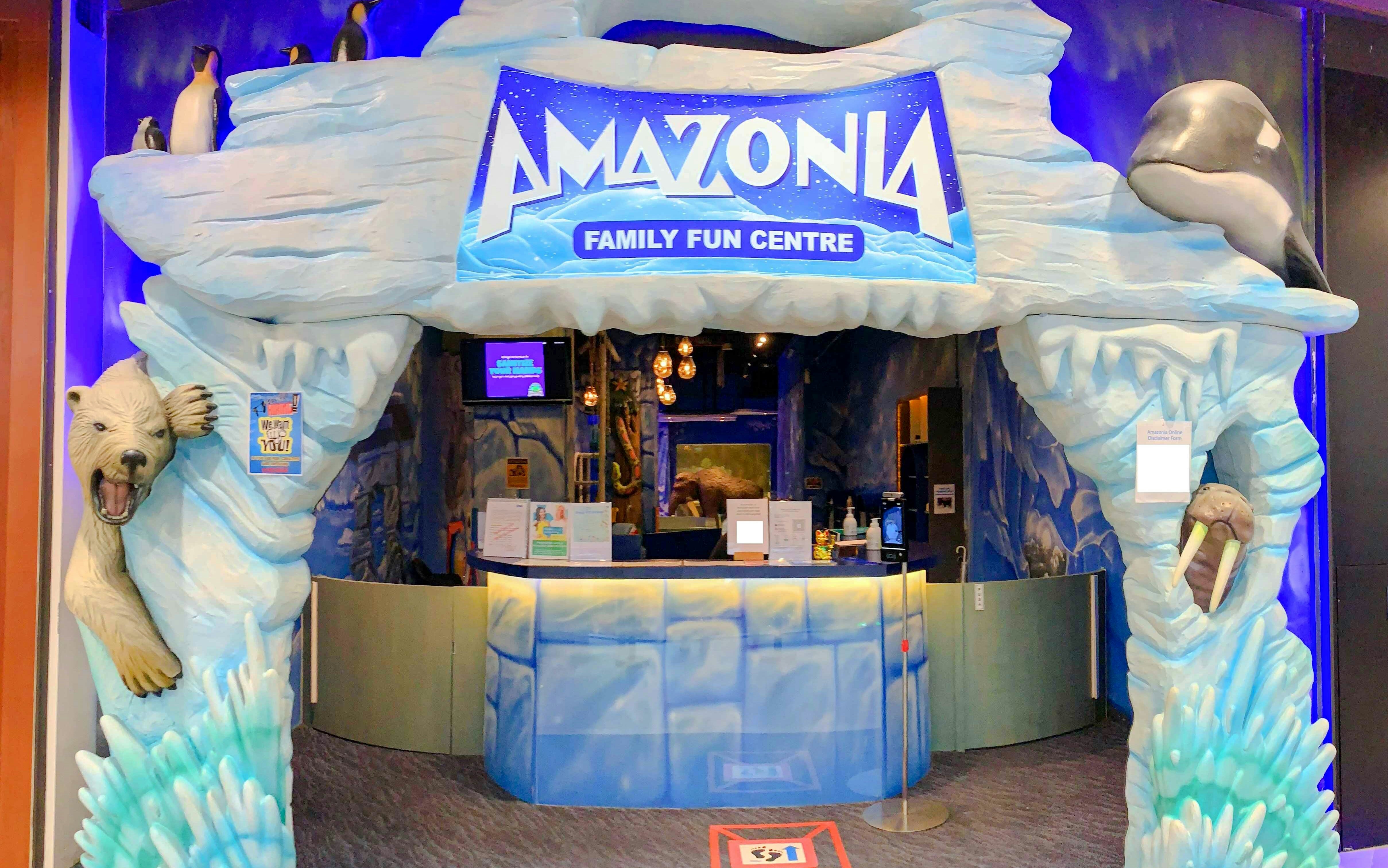 Entrance to Amazonia Family Fun Centre in Singapore with polar bear and penguin sculptures.