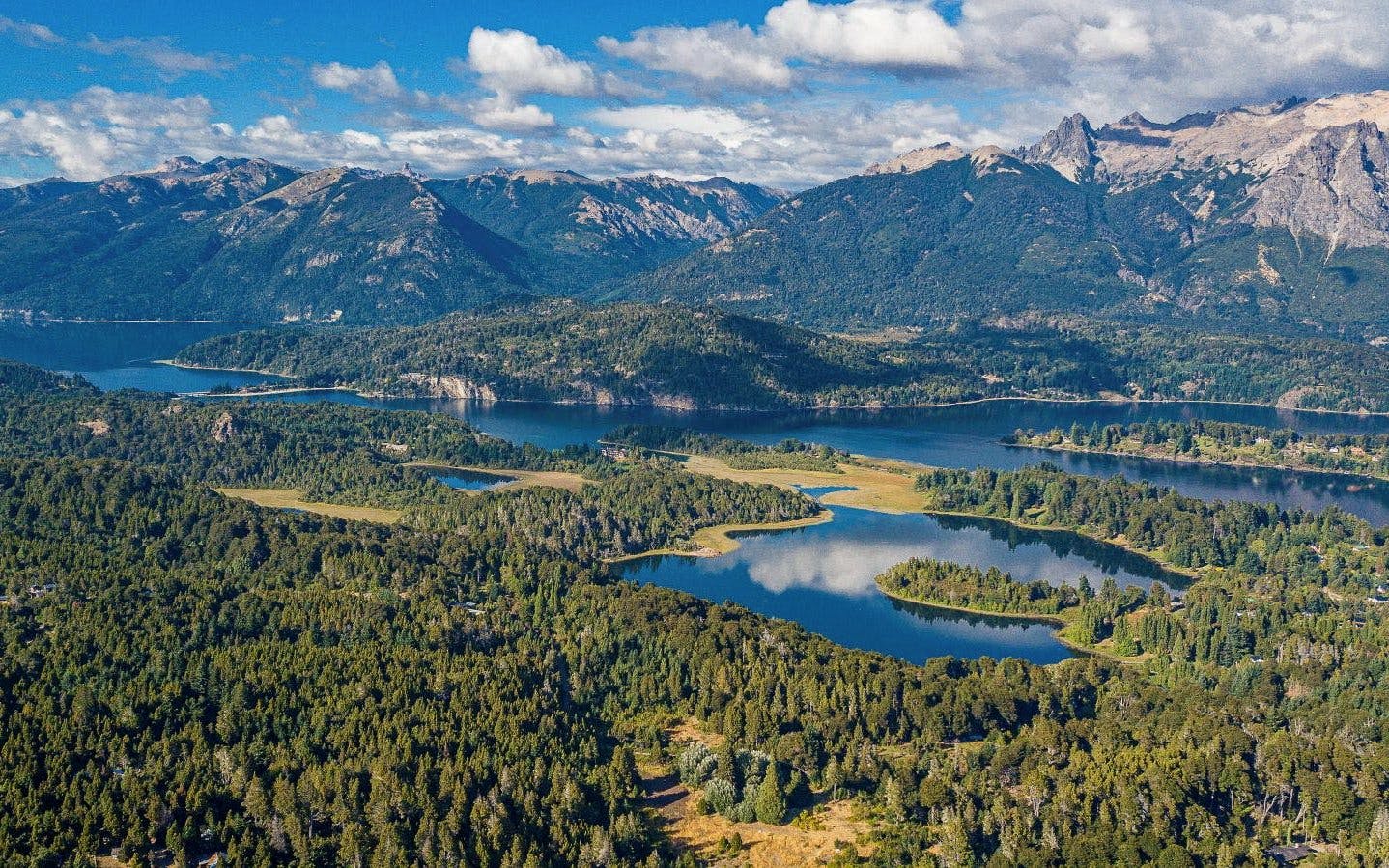 Panoramic view of forests, lakes, and mountains along Circuito Chico in Argentina.