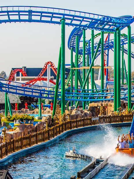 Roller coaster and water ride at Energylandia Amusement Park, Poland.