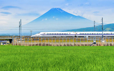 Bullet train passing in front of Mount Fuji on route to Tokyo.
