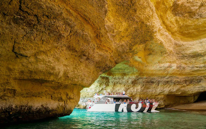 Catamaran entering Benagil Cave on a cruise from Albufeira.