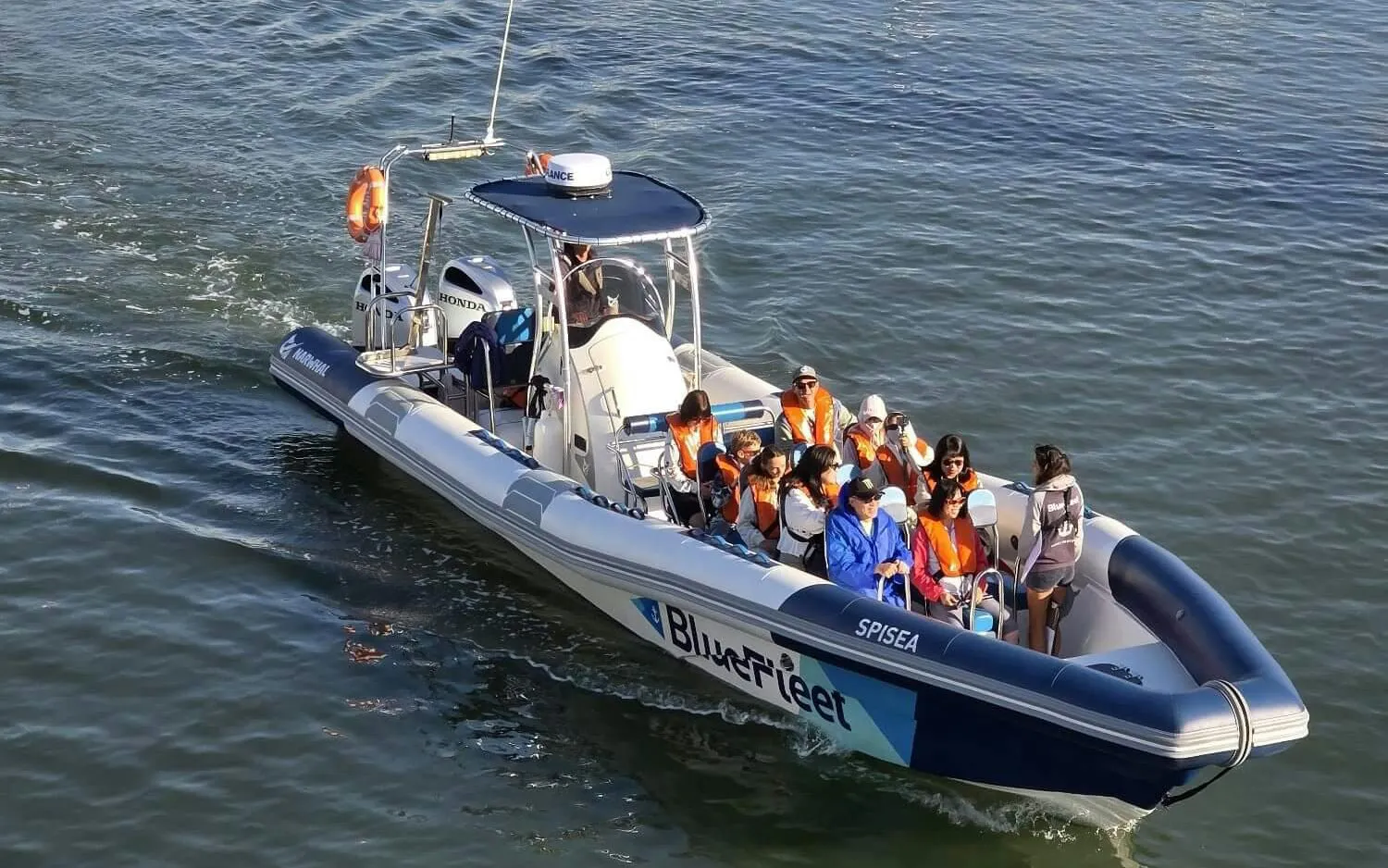 Tourists on a boat during a dolphin watching cruise from Lagos.