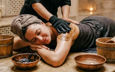 Traditional Marrakchi hammam massage with black soap in Marrakesh spa.