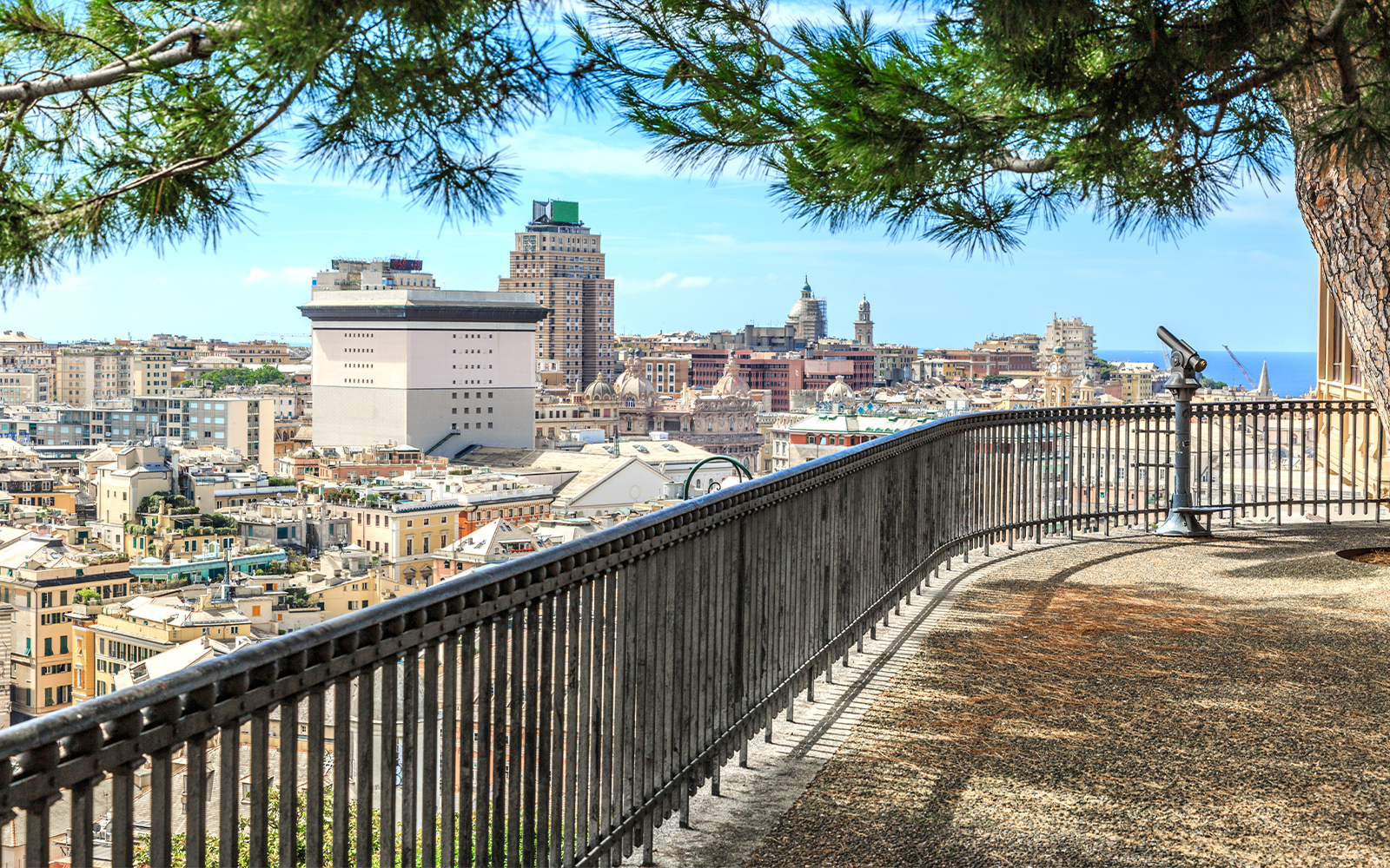 View of Genoa from Spianata Castelletto, showcasing cityscape and harbor.