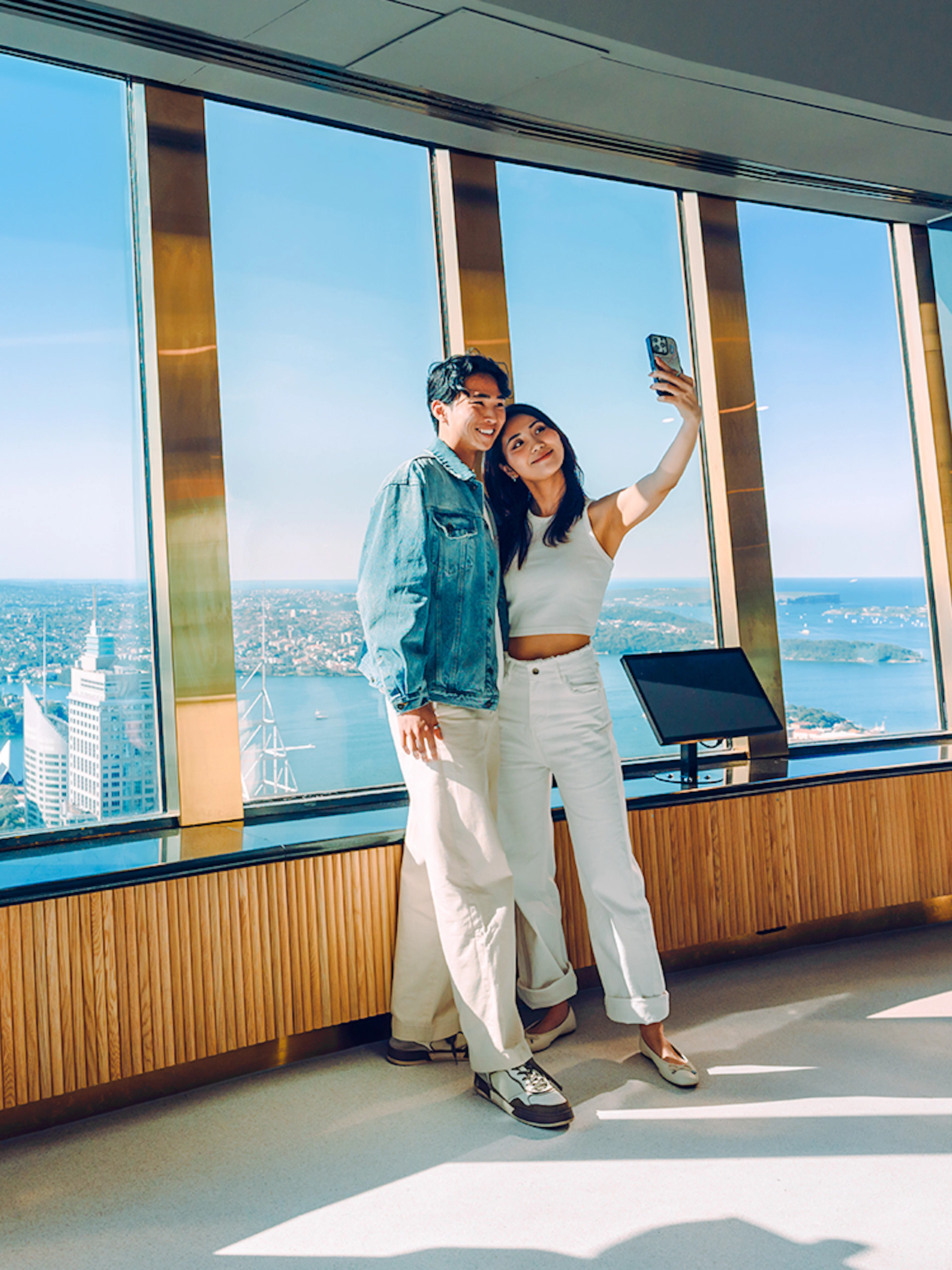 Couple taking a selfie on the viewing deck of Sydney Tower Eye.