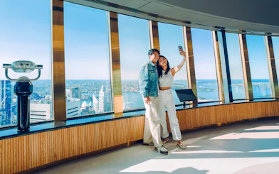 Couple taking a selfie on the viewing deck of Sydney Tower Eye.