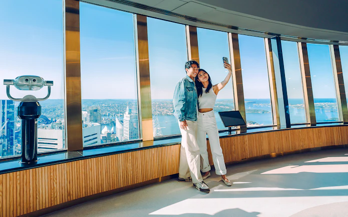 Couple taking a selfie on the viewing deck of Sydney Tower Eye.