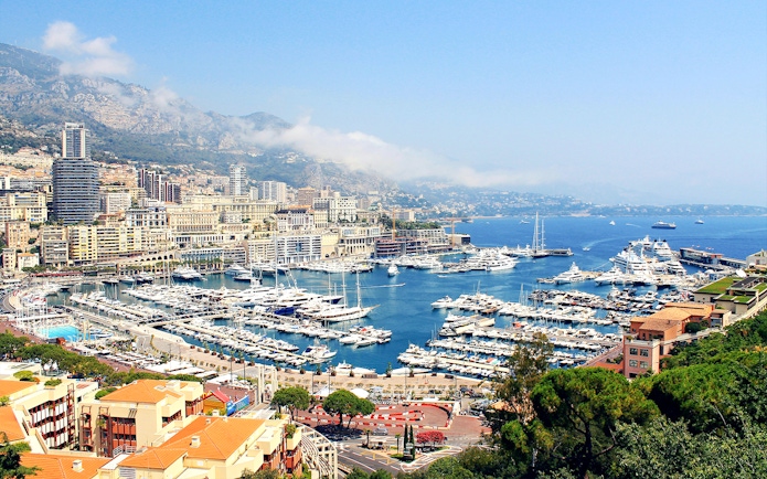 Monaco harbor view with yachts and cityscape, part of the Monaco day tour from Nice.