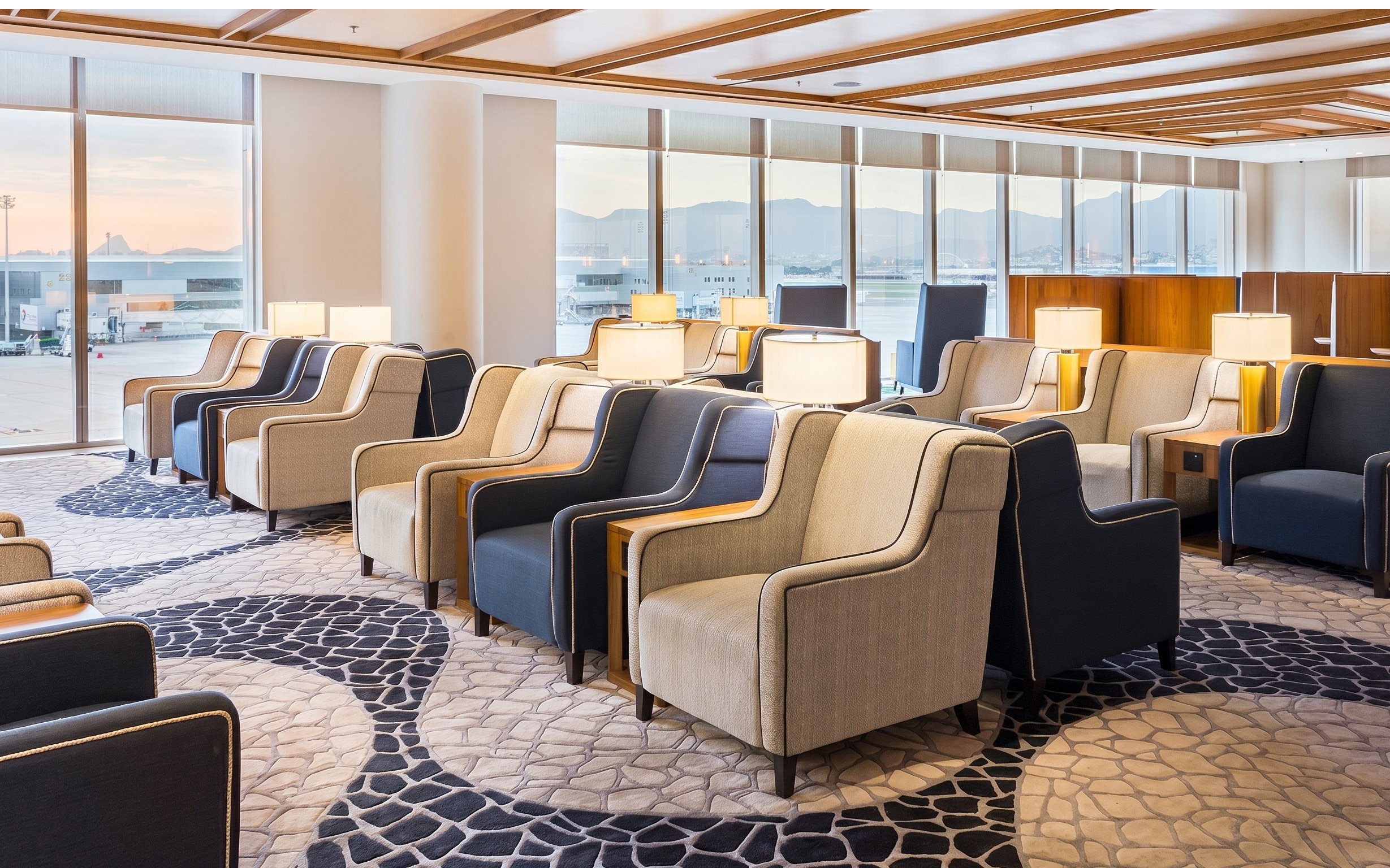 Seating area in Plaza Premium Lounge at Rio de Janeiro Airport, T2, with runway view.