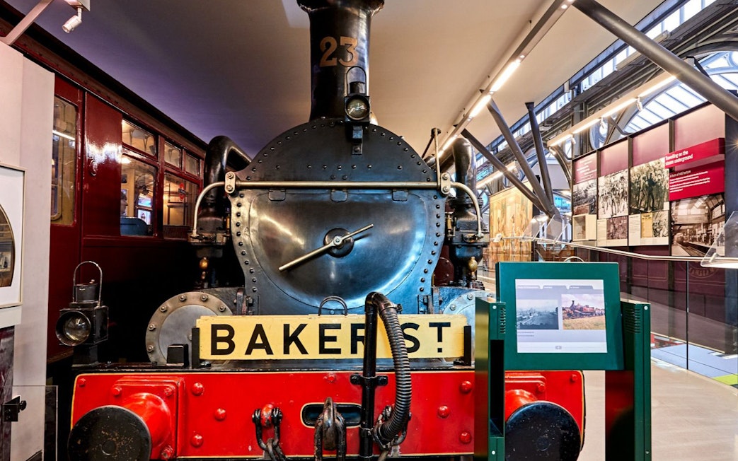 Steam locomotive exhibit at London Transport Museum with Baker Street sign.