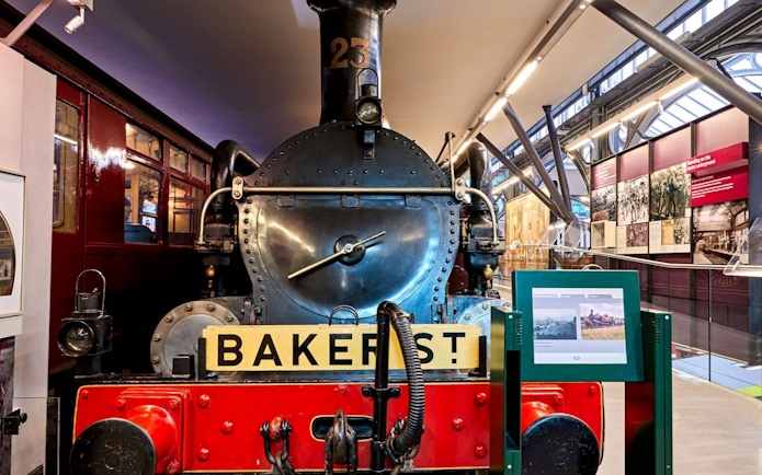 Steam locomotive exhibit at London Transport Museum with Baker Street sign.