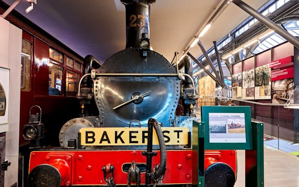 Steam locomotive exhibit at London Transport Museum with Baker Street sign.