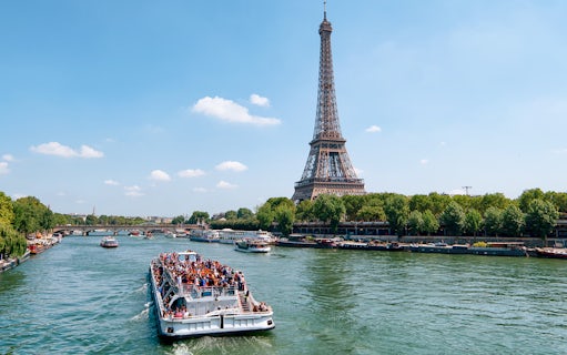 Seine River cruise with view of Eiffel Tower and Parisian architecture.