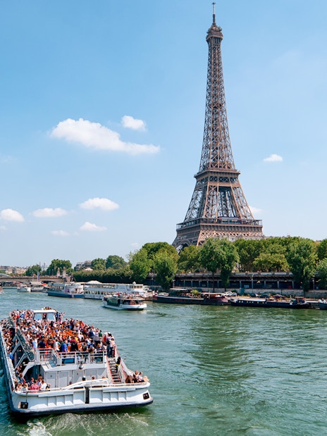 Seine River cruise with view of Eiffel Tower and Parisian architecture.
