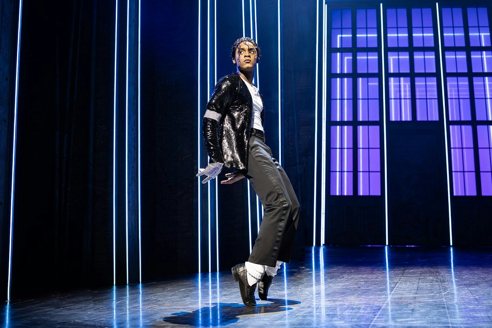 Performer on stage during MJ the Musical in Brisbane, striking a dance pose.