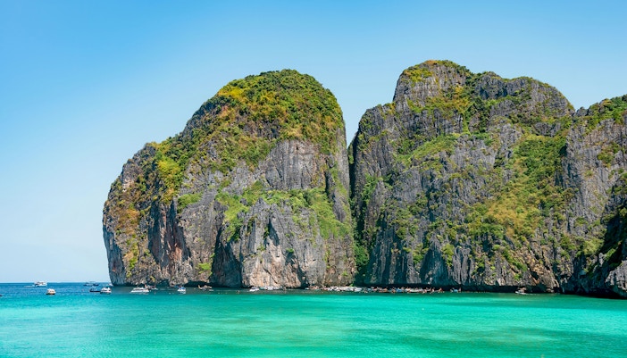 Boats and distant mountains in Maya Bay and Phi Phi Island