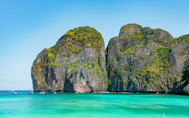 Phi Phi Island cliffs and turquoise water, Phuket Sunset Tour.