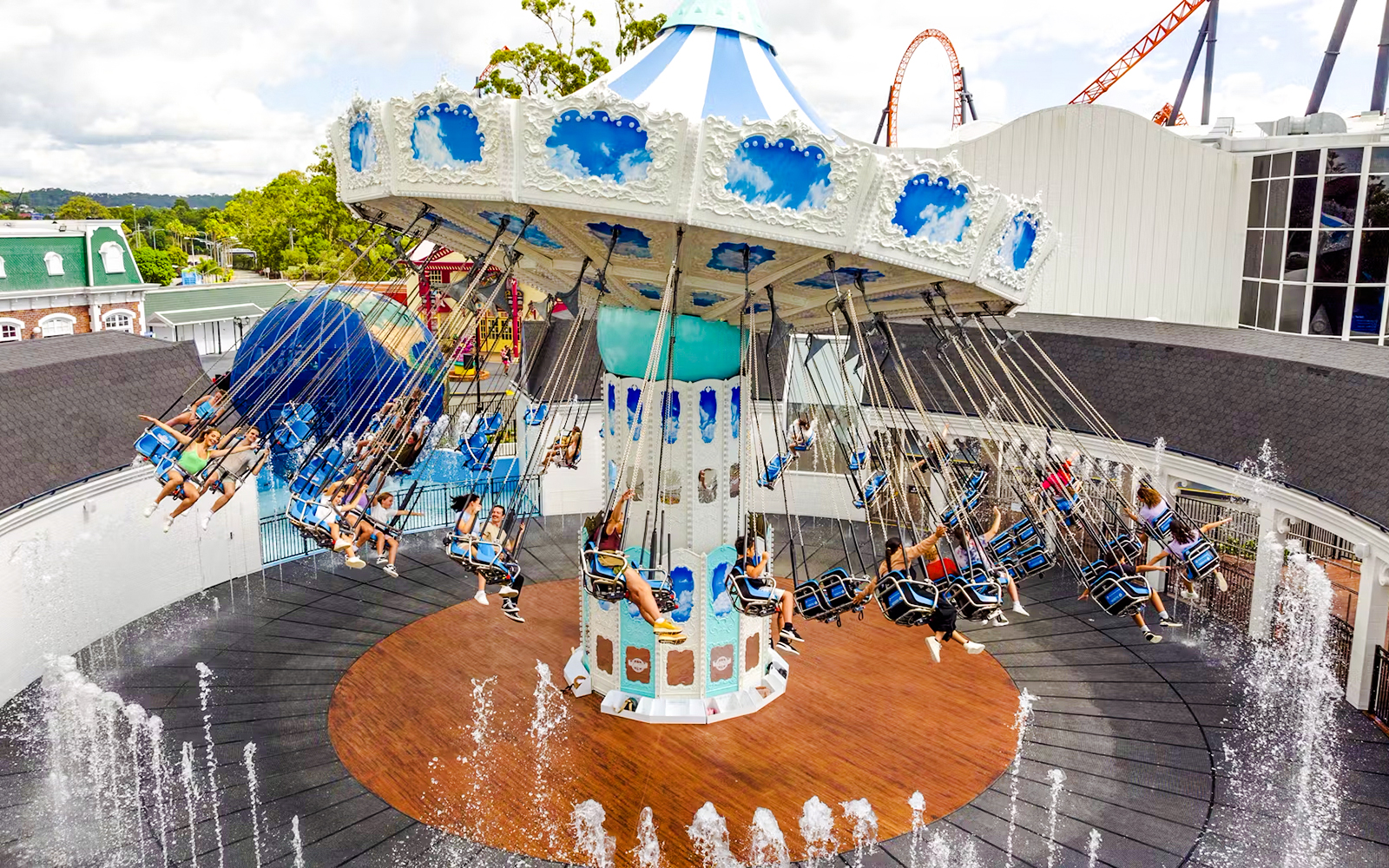 Dreamworld Flyer ride at Dreamworld, Gold Coast, with people enjoying the thrilling aerial view.