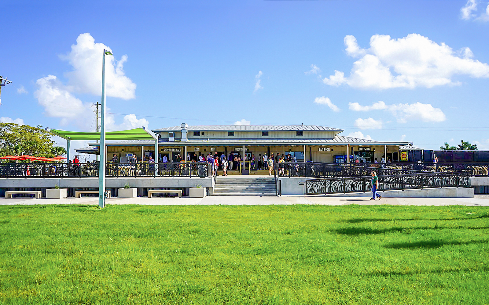 Holiday Park entrance with visitors gathering for airboat tour and wildlife show.